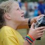 Yellow camper flying her plane at the Fly Field